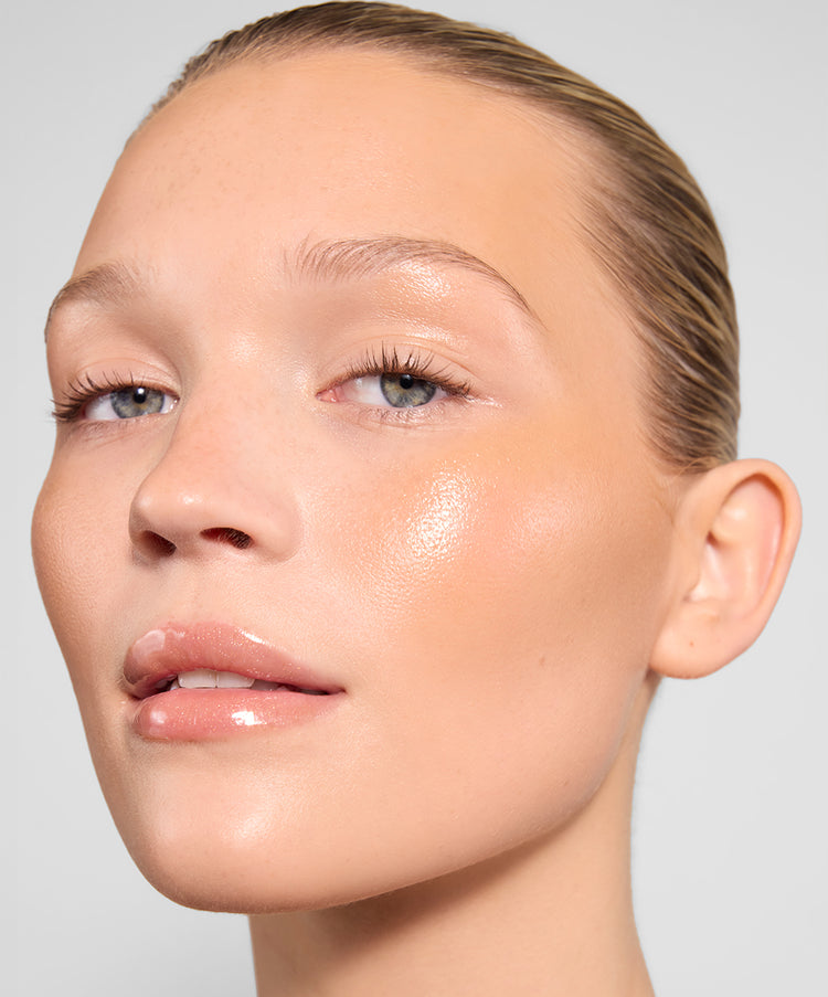| desc: Jemima wears Topaz Lip Gloss,<br> Sand Cream Bronzer & Gloss Highlighter