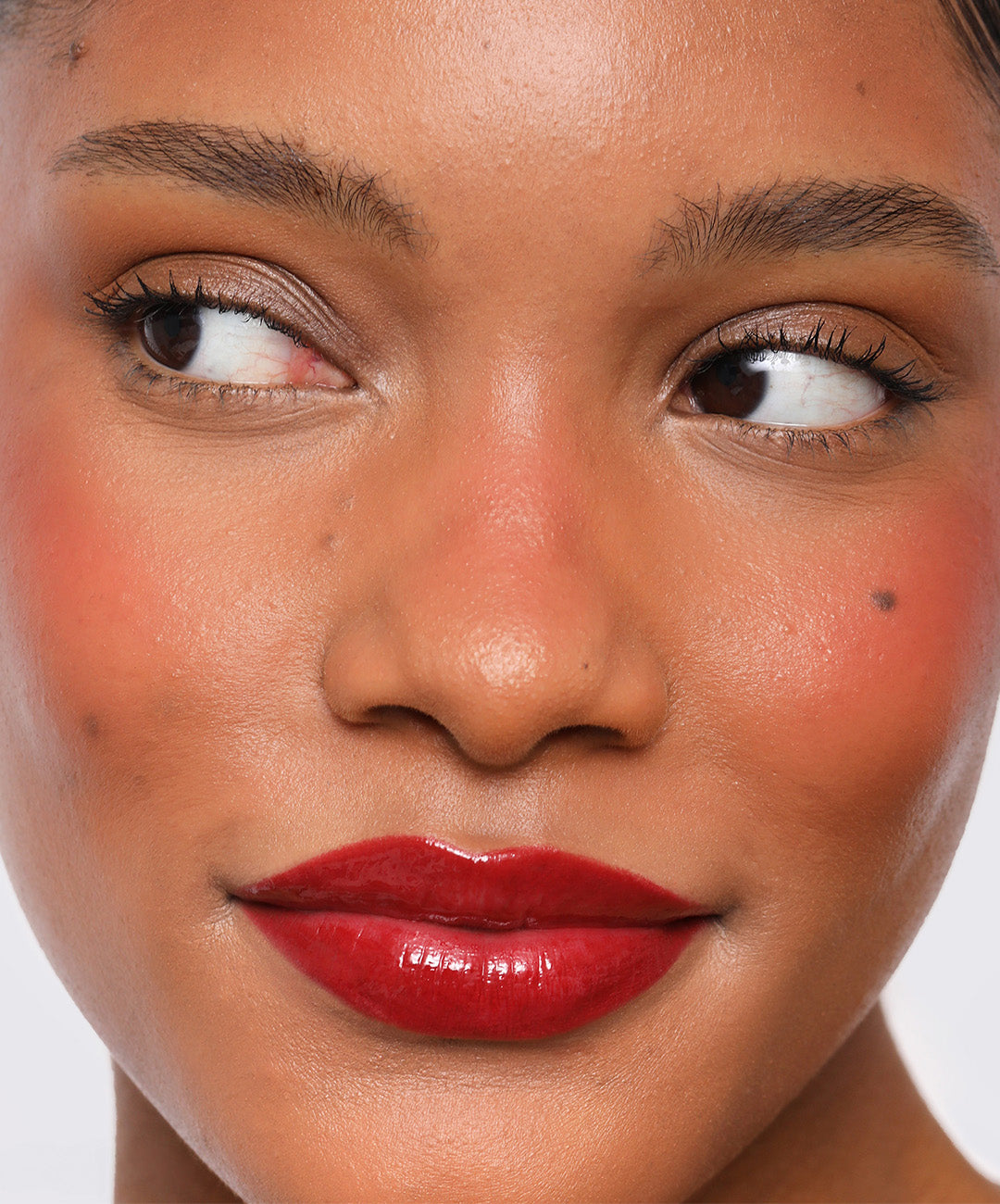 | desc:  Model wears Lip Sculpt in shade Red